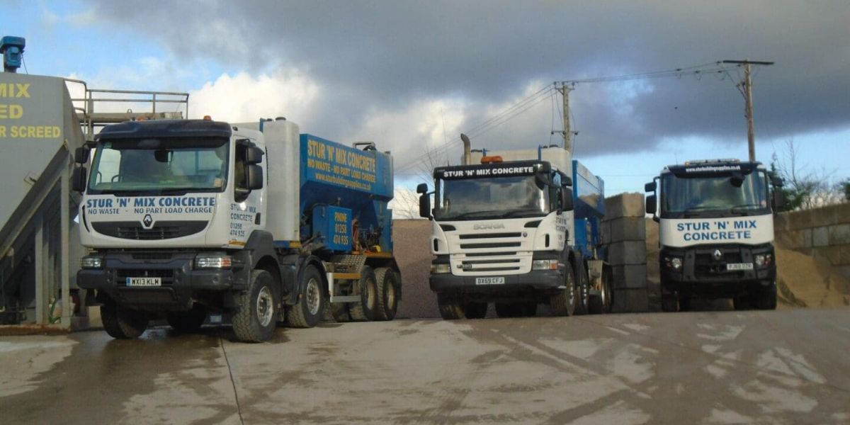 three big lorries with branding on the side